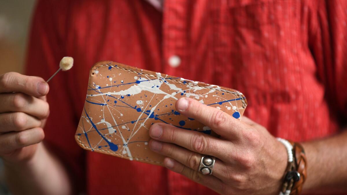 Peter Maxwell handcrafts a leather wallet at Made Solid.