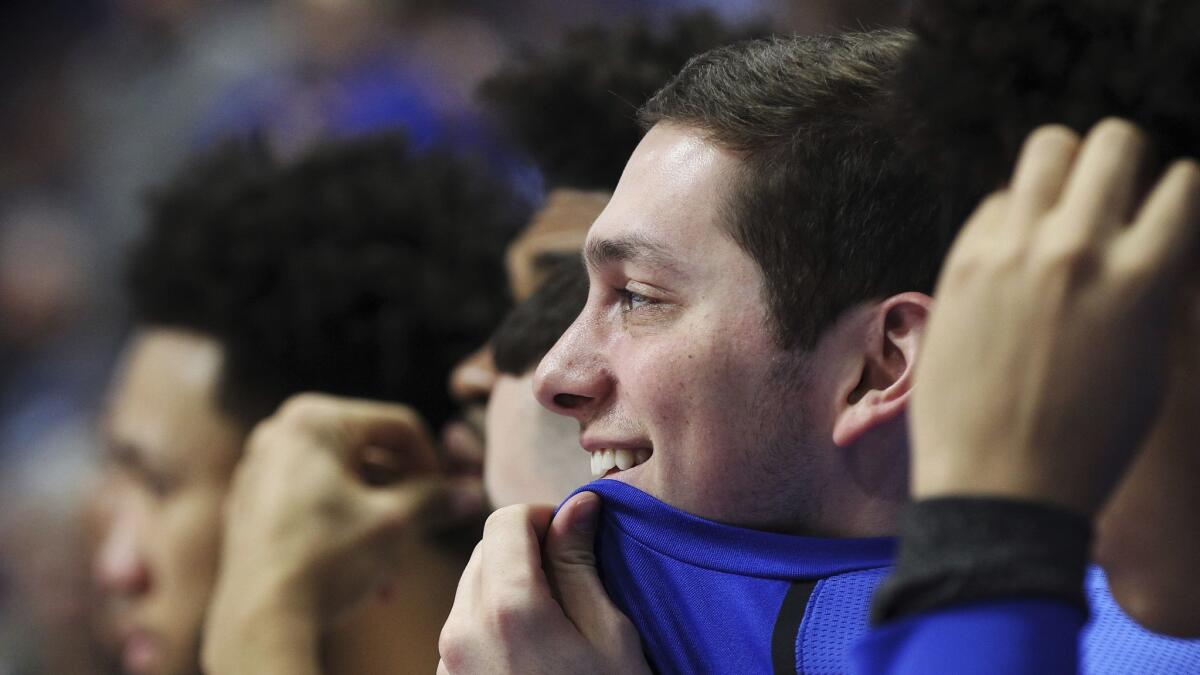 Kentucky senior Jonny David smiles as the crowd chants his name late in the second half of a game against Florida.