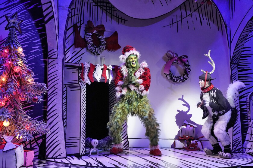 The family-friendly musical "Dr. Seuss's How the Grinch Stole Christmas!" returns for another season at the Old Globe Theatre in San Diego. With Edward Watts, left, and Tommy Martinez.