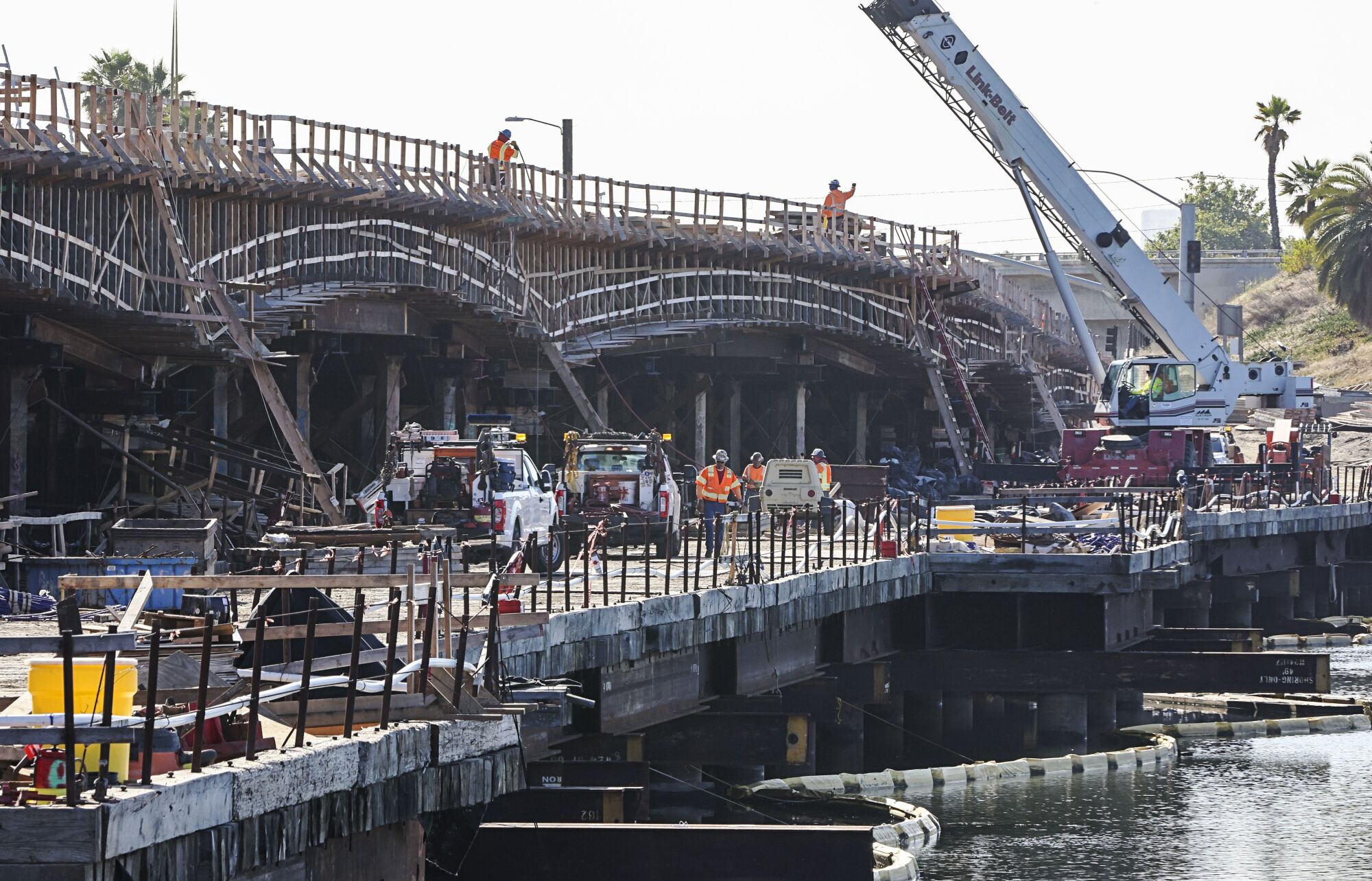 Construction crews work on the new West Mission Bay Bridge.