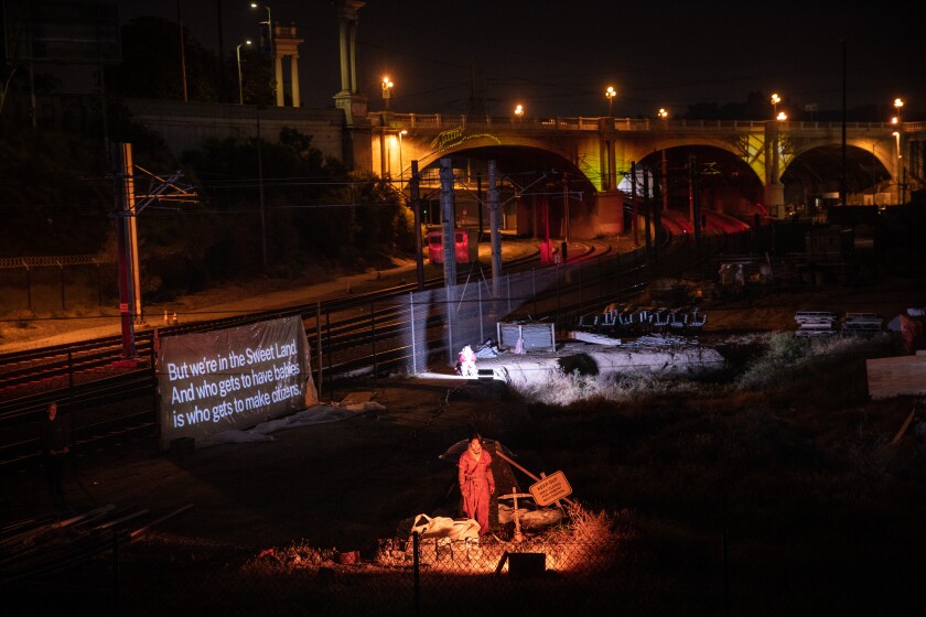A scene from “Sweet Land” with the North Broadway Bridge in the background