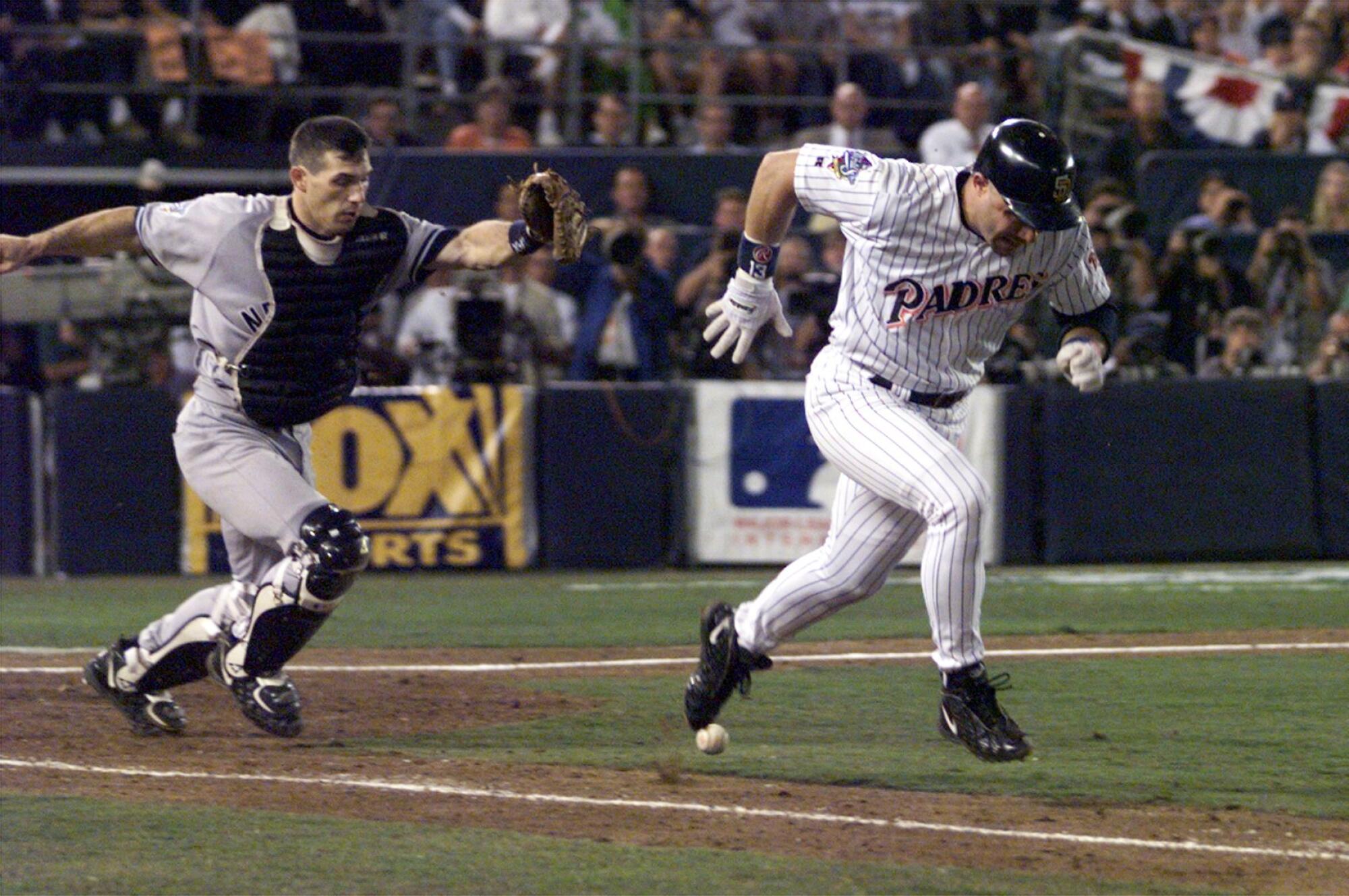 San Diego Padres batter Jim Leyritz is thrown out at first by Yankees catcher Joe Girardi.