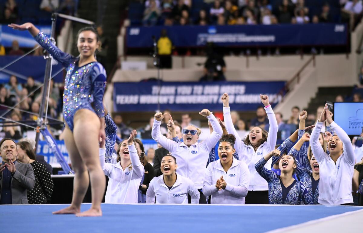 Katelyn Ohashi completes her floor routine as teammates cheer her on during NCAA semifinals in Fort Worth.