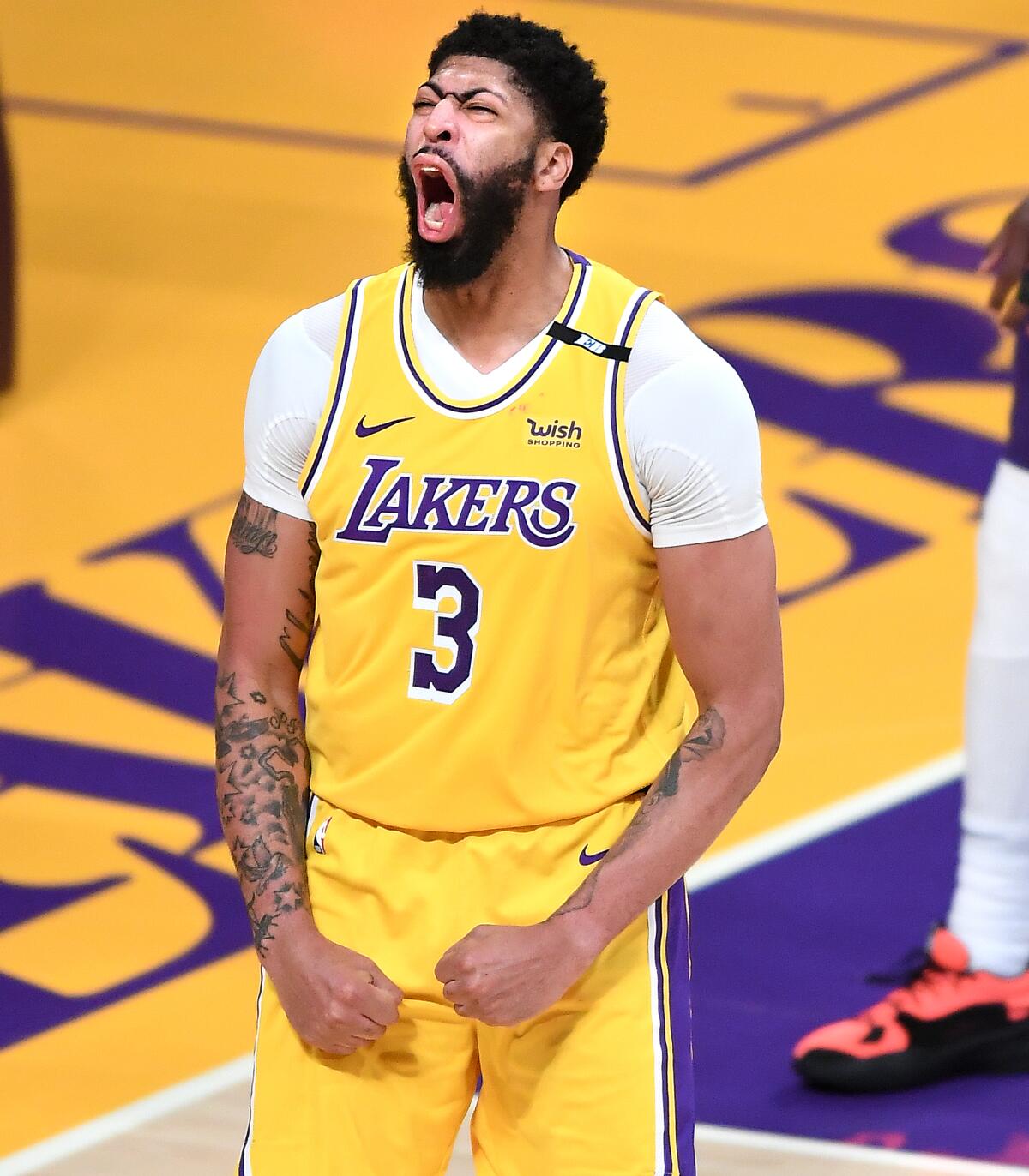 Lakers forward Anthony Davis celebrates after scoring a basket during Game 3 against the Phoenix Suns.