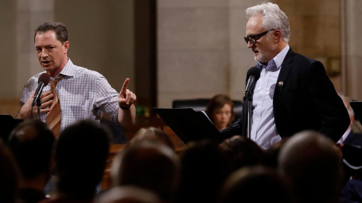 Joshua Malina, left, as Carl Bernstein and Bradley Whitford as Bob Woodward read the screenplay to "All the President's Men" on Saturday in a presentation organized by the Fountain Theatre in Los Angeles City Council chambers at City Hall.