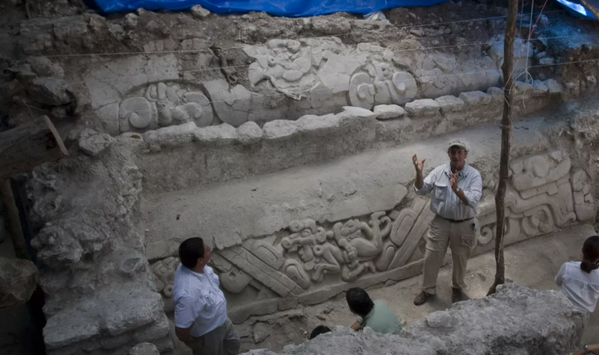 Archaeologist Richard Hansen shows a limestone frieze found at the El Mirador archaeological site