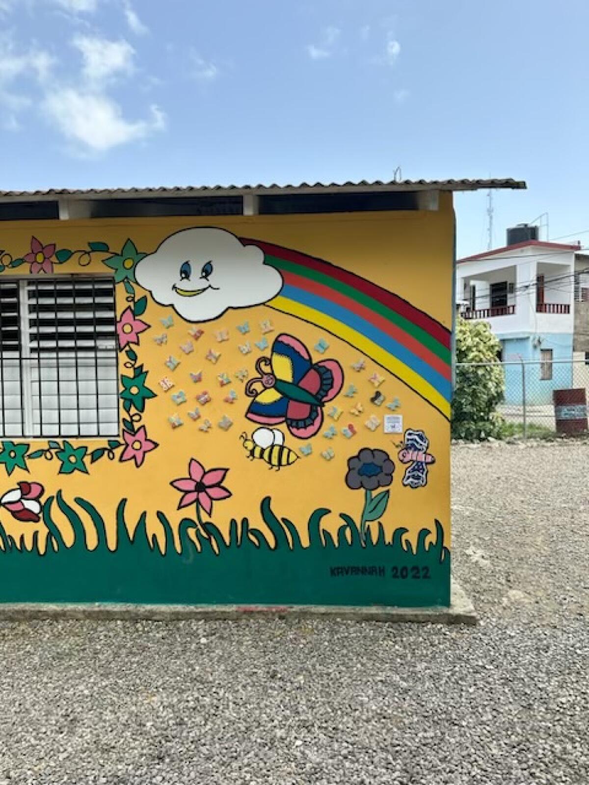 Ceramic butterflies adorn a mural at the La Libertad school in the Dominican Republic.