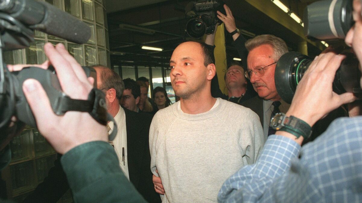 In this April 25, 1997 file photo, Andrew Urdiales walks in police custody at police headquarters in Chicago. Urdiales was convicted of murdering five women in Southern California more than two decades ago. An jury on Wednesday recommended that he receive the death penalty.