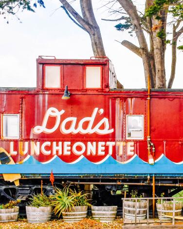 Dad's Luncheonette, painted on a train car