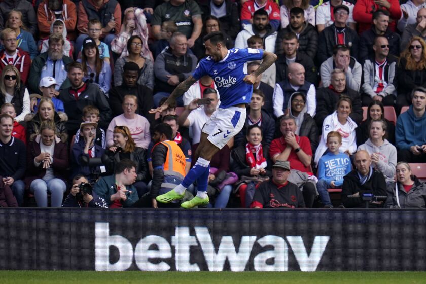 Everton's Dwight McNeil celebrates after scoring during their English Premier League soccer match against Southampton at St. Mary's Stadium, Southampton, England, Saturday, Oct. 1, 2022. (Andrew Matthews/PA via AP)