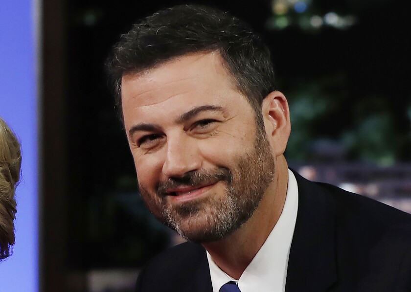 FILE - In this Aug. 22, 2016, file photo, ABC talk show host Jimmy Kimmel poses with then Democratic presidential nominee Hillary Clinton, unseen, during a break in taping of "Jimmy Kimmel Live!" in Los Angeles. Kimmel announced Wednesday, June 17, 2021, on his show that he will be the title sponsor of college football's LA Bowl that is scheduled to be played Dec. 18 at SoFi Stadium in Inglewood, Ca. (AP Photo/Carolyn Kaster, File)