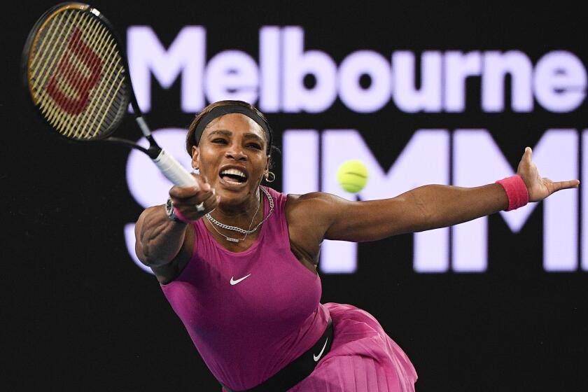 United States' Serena Williams makes a forehand return to compatriot Danielle Collins during a tuneup.