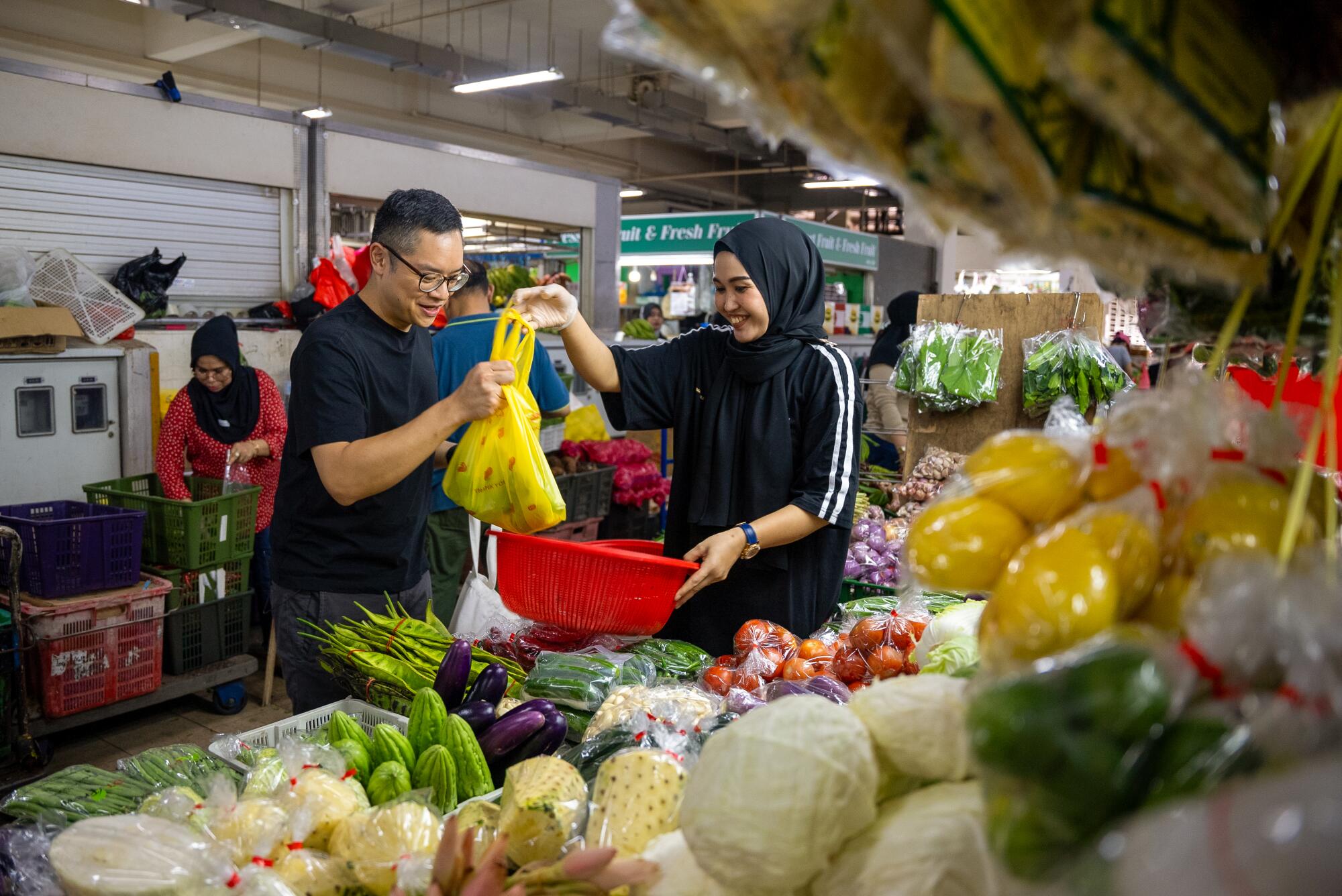 Chef Malcolm Lee shops for ingredients at Geylang Serai market in Central Singapore.