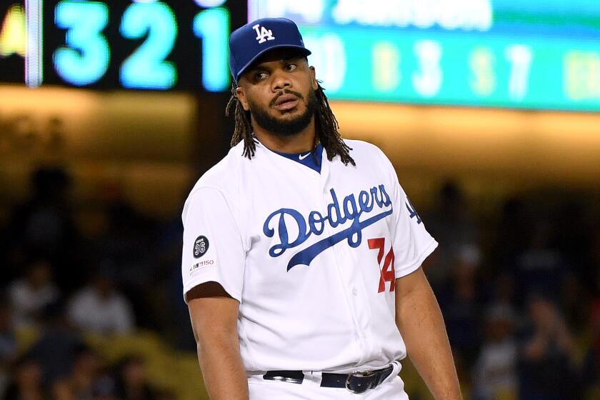 Dodgers' Kenley Jansen reacts after giving up  a solo homerun to Toronto Blue Jays' Rowdy Tellez to tie the game 1-1, during the ninth inning at Dodger Stadium on Wednesday.
