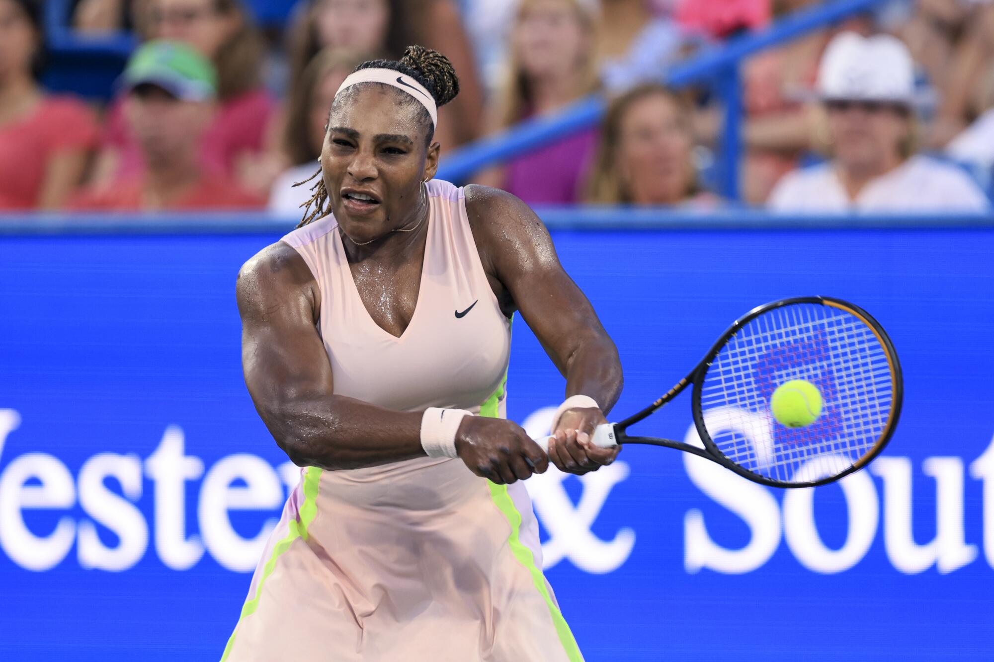 Serena Williams hits a backhand during her match against Emma Raducanu at the Western & Southern Open on Aug. 16.