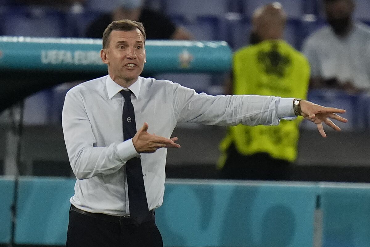 FILE - Ukraine's manager Andriy Shevchenko gestures during the Euro 2020 soccer championship quarterfinal match between Ukraine and England at the Olympic stadium in Rome, Italy, on July 3, 2021. Genoa hired former AC Milan and Chelsea forward Andriy Shevchenko as coach on Sunday, a day after firing Davide Ballardini. The 45-year-old Shevchenko signed a contract until June 2024. (AP Photo/Alessandra Tarantino, Pool)