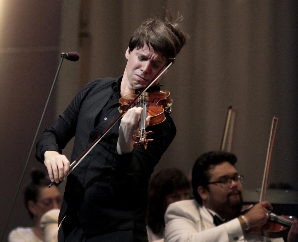 Violinist Joshua Bell opened the Los Angeles Philharmonic's summer season at the Hollywood Bowl on Tuesday, with Bramwell Tovey conducting the crossover-heavy program.