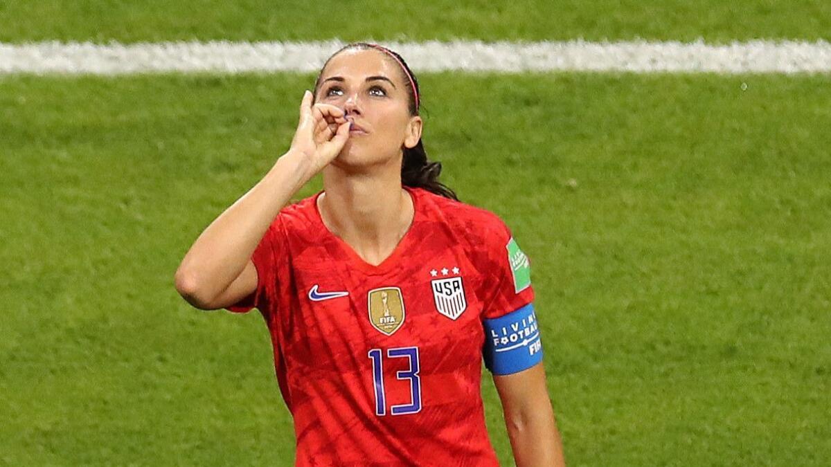 Alex Morgan pretends to enjoy a cup of tea after scoring against England on Tuesday during the Women's World Cup semifinals in Lyon, France.
