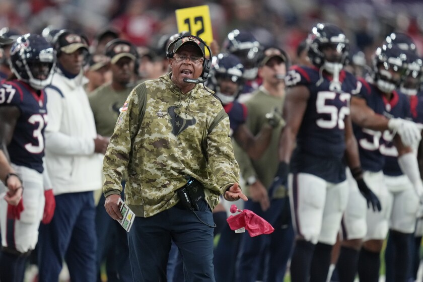 Houston Texans head coach David Culley tosses a challenge flag in the second half of an NFL football game against the New York Jets in Houston, Sunday, Nov. 28, 2021. The Jets won 21-14. (AP Photo/Eric Smith)