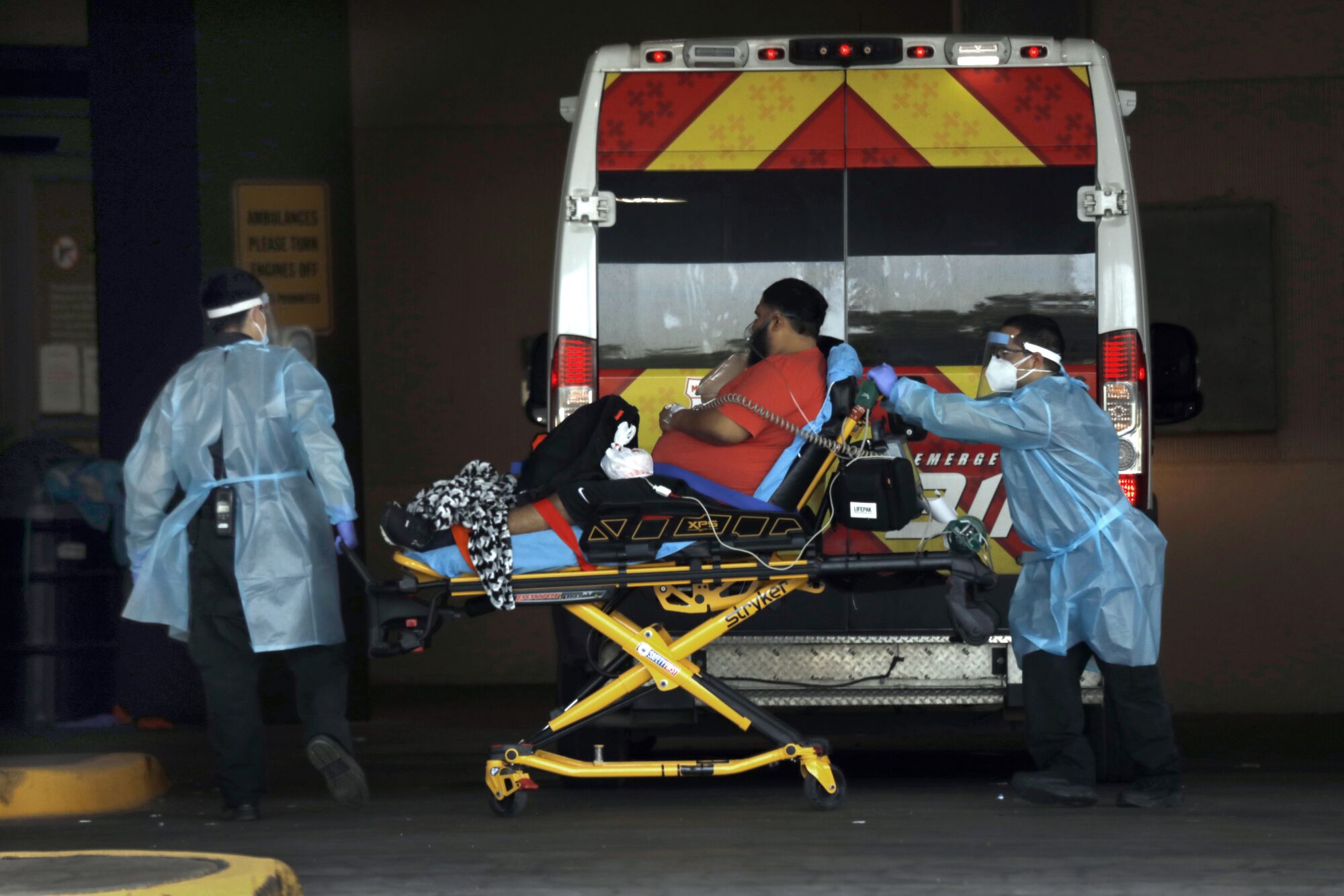 A man is transported to a hospital on a gurney in McAllen, Texas.