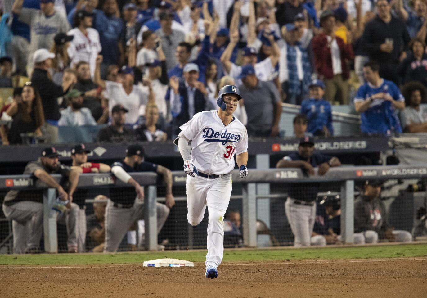 Dodgers left fielder Joc Pederson runs the bases after hitting a solo homer giving the Dodgers a 1-0 lead against the Red Sox in the third inning.