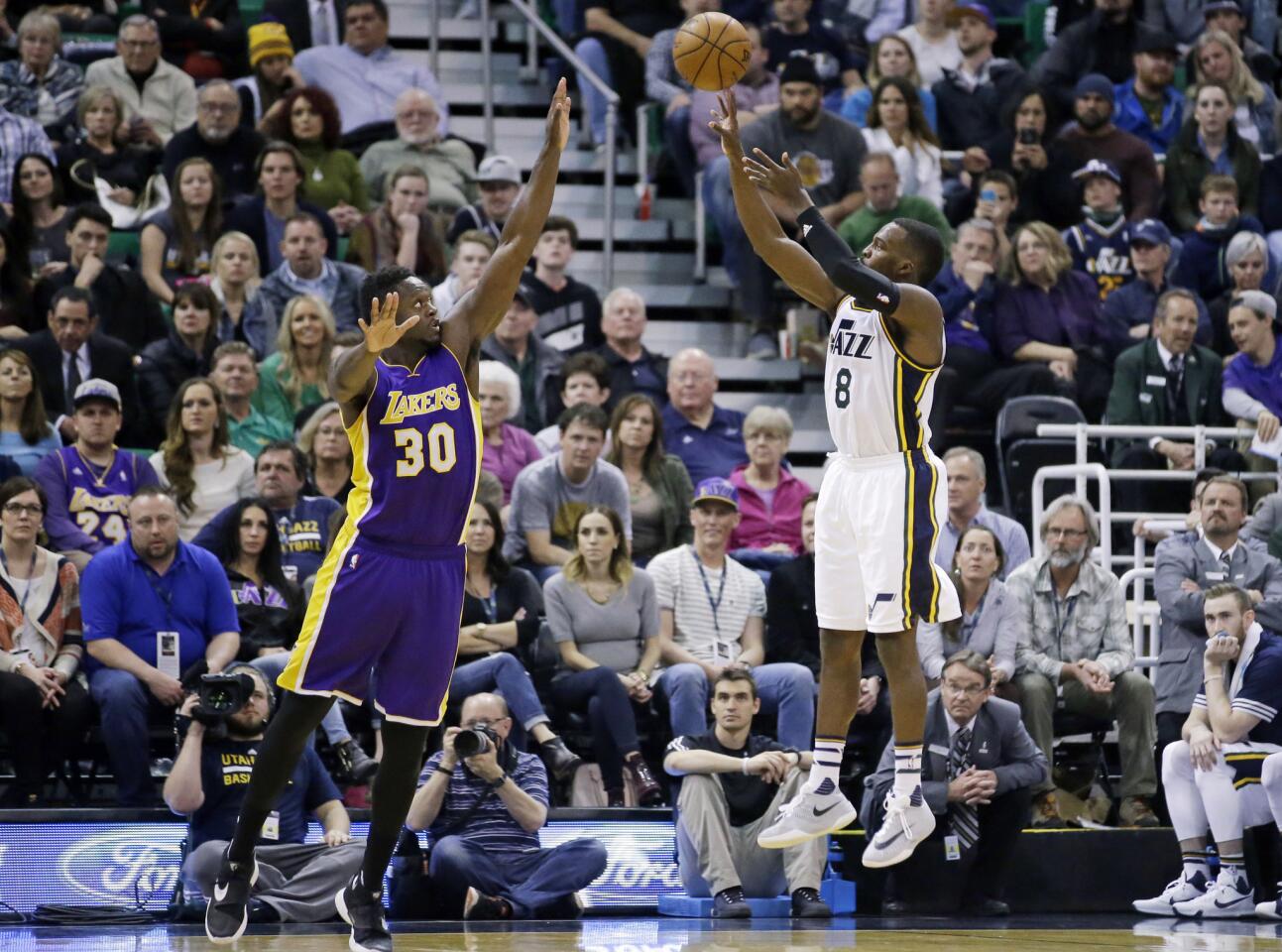 Utah Jazz guard Shelvin Mack (8) shoots over Lakers forward Julius Randle (30) during the second quarter.