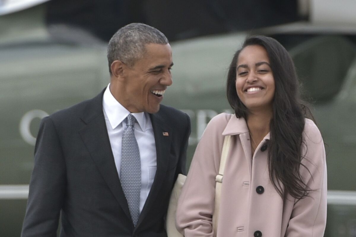 Barack Obama and daughter Malia Obama, who will be interning with the Weinstein Co. this spring.