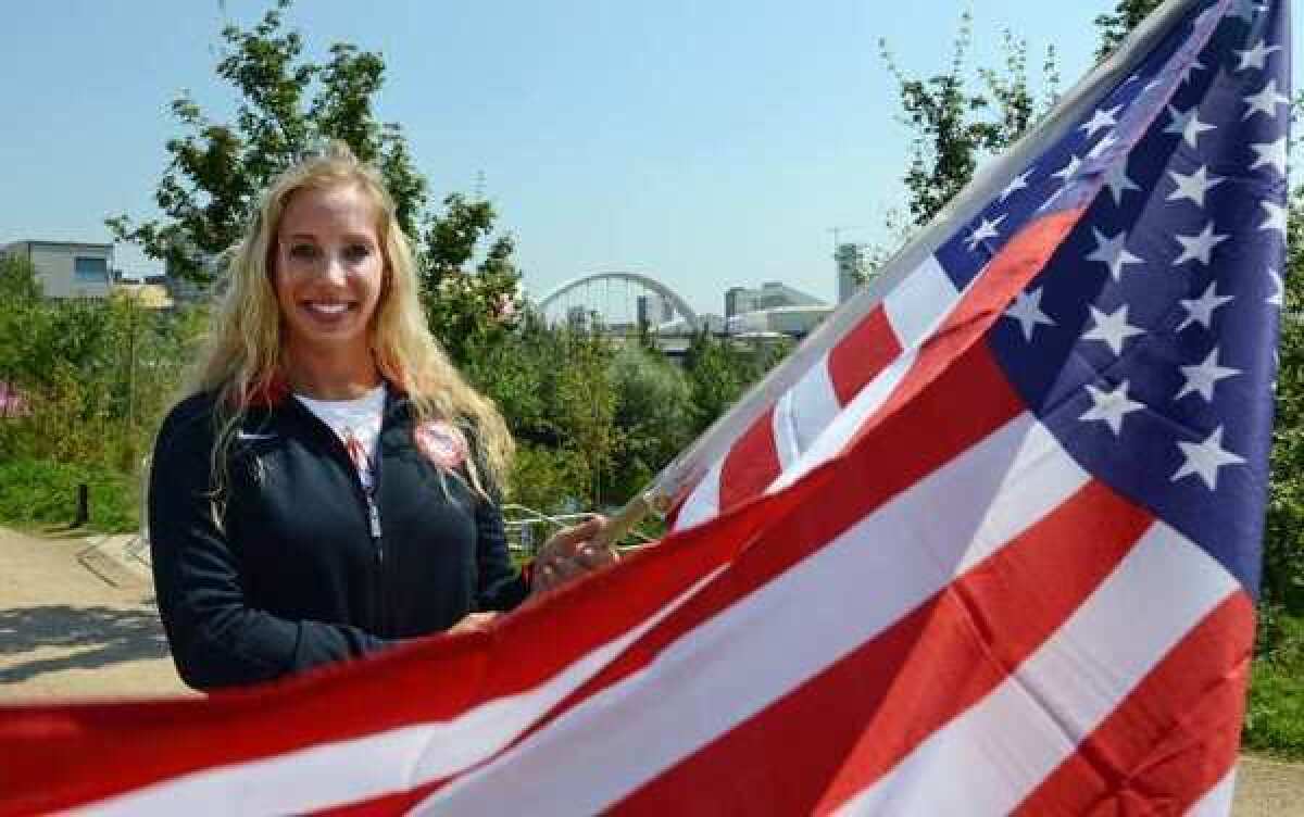 U.S. flag bearer Mariel Zagunis.