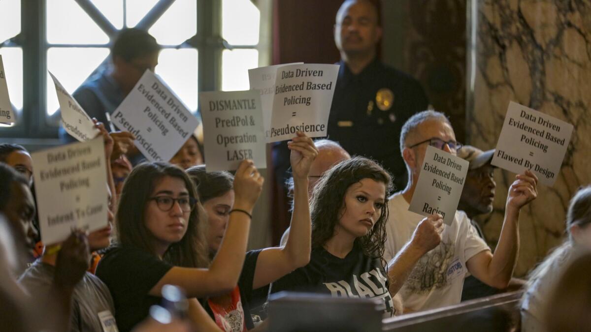 Protesters attend the Los Angeles Police Commission's special meeting on the LAPD's use of data in policing.
