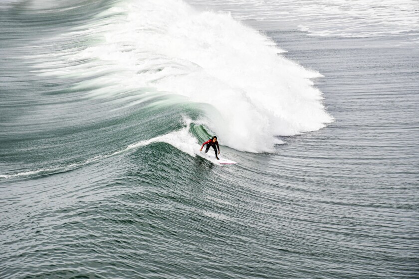 Once-overlooked Oceanside has a new vibe. Visit now before it becomes a tourist hotspot 17 A surfer rides a wave near the Oceanside Pier.