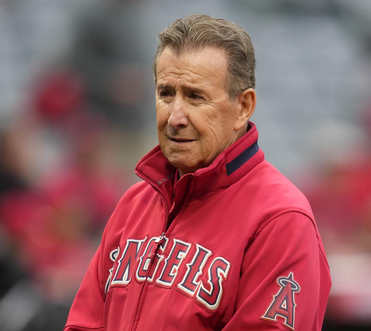 Arte Moreno, owner of the Los Angeles Angels, stands on the field.