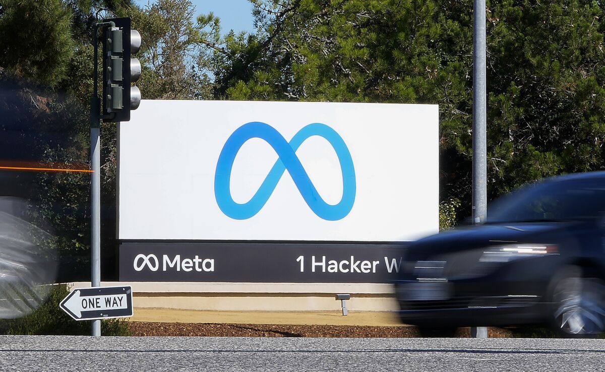 FILE - A car passes Facebook's new Meta logo on a sign at the company headquarters on Oct. 28, 2021, in Menlo Park, Calif. For years, Facebook, now called Meta, has pushed a narrative that it was a neutral platform in Myanmar that was misused by bad actors and failed to moderate violent and hateful material adequately. But a new report by Amnesty International says Facebook was not merely a passive site with insufficient content moderation. Rather, Meta’s algorithms “proactively amplified" material that incited violent hatred against the Rohingya beginning as early as 2012. (AP Photo/Tony Avelar, File)
