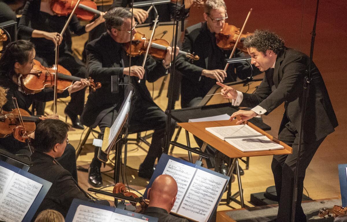 Gustavo Dudamel conducts the LA Philhamonic as they perform Prokofiev?s Romeo and Juliet with members of the L.A. Dance Project at the Walt Disney Concert Hall in Los Angeles, Calif., on Oct. 18, 2018. (Brian van der Brug / Los Angeles Times)