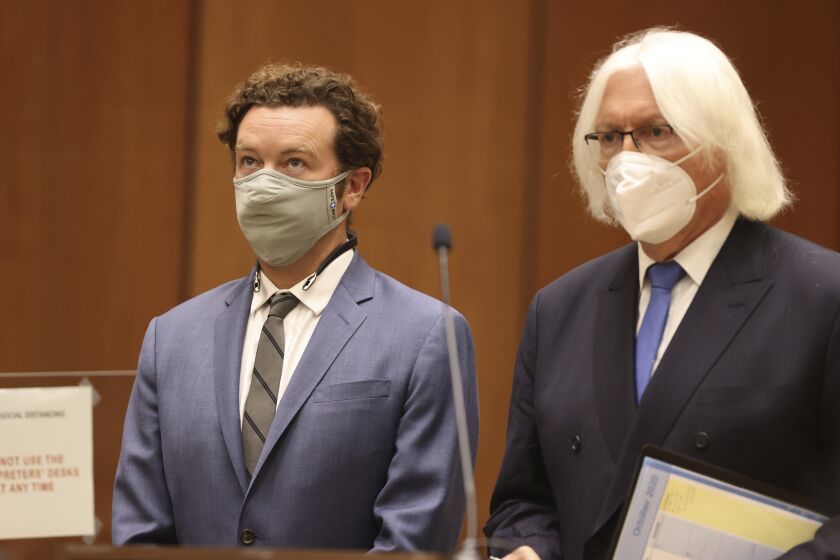 Actor Danny Masterson, left, stands with his attorney, Thomas Mesereau as he is arraigned on rape charges at Los Angeles Superior Court, in Los Angeles, Calif. on Friday, Sept. 18, 2020. (Lucy Nicholson/Pool Photo via AP)