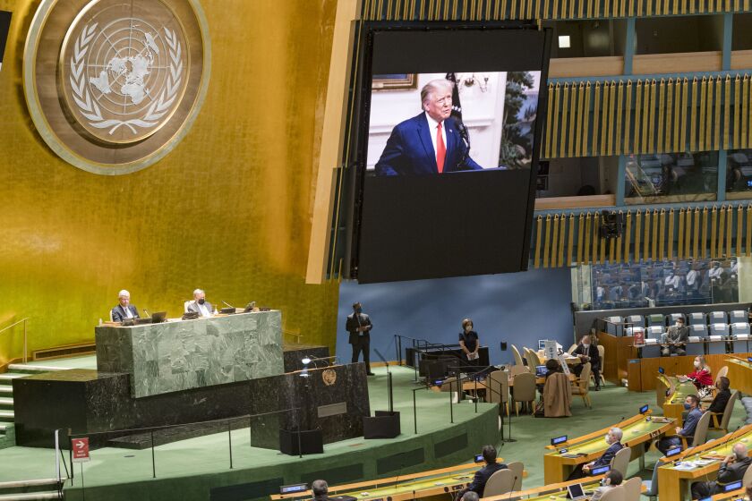 In this photo provided by the United Nations, U.S. President Donald Trump, is on video screens as his pre-recorded message is played during the 75th session of the United Nations General Assembly, Tuesday, Sept. 22, 2020, at UN Headquarters in New York. The U.N.'s first virtual meeting of world leaders started Tuesday with pre-recorded speeches from some of the planet's biggest powers, kept at home by the coronavirus pandemic that will likely be a dominant theme at their video gathering this year. (UN Photo/Rick Bajornas via AP)