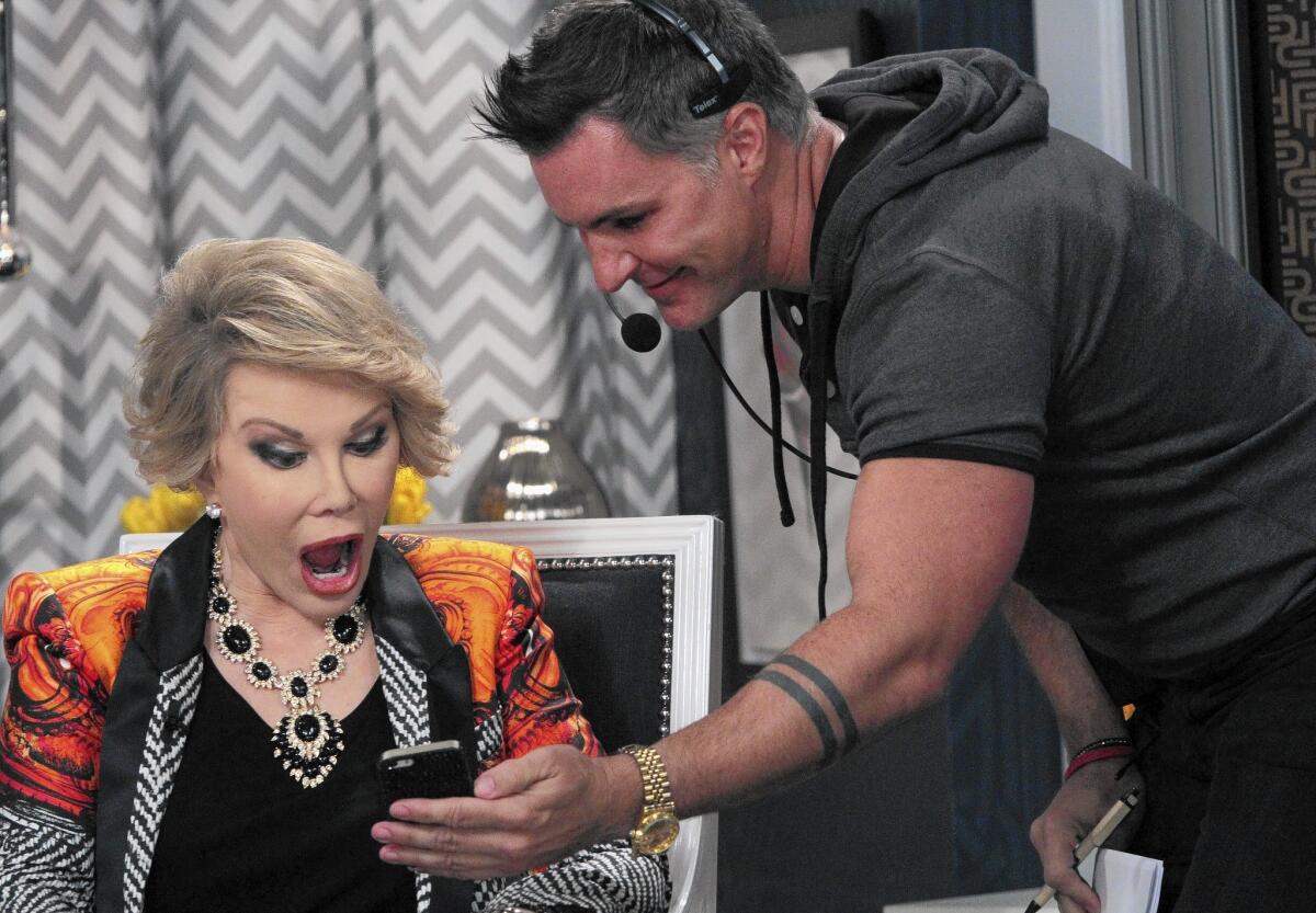 The tables are turned, at least for a moment, as Joan Rivers reads a jaw-dropping text from “Fashion Police” writer Tony Tripoli during a break in taping.