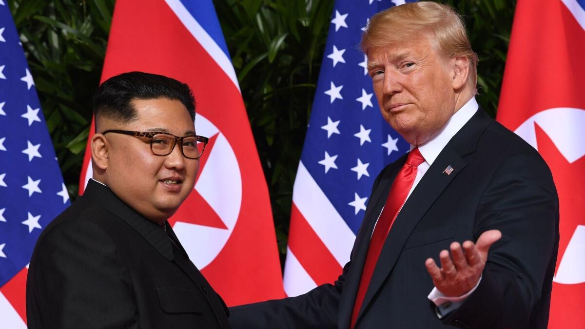 President Trump meets with North Korea's leader Kim Jong Un at the start of their summit in Singapore last year. Trump said Friday that he will hold his second summit with Kim in Hanoi, Vietnam.