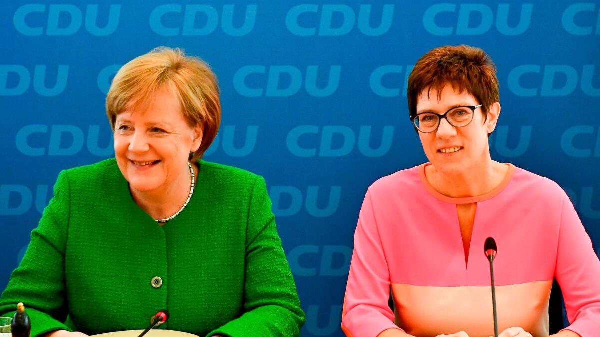 German Chancellor Angela Merkel, left, and state premier of Saarland, Annegret Kramp-Karrenbauer, pose ahead of a leadership meeting of their Christian Democrats Party (CDU) on Feb. 19 at the CDU headquarters in Berlin.