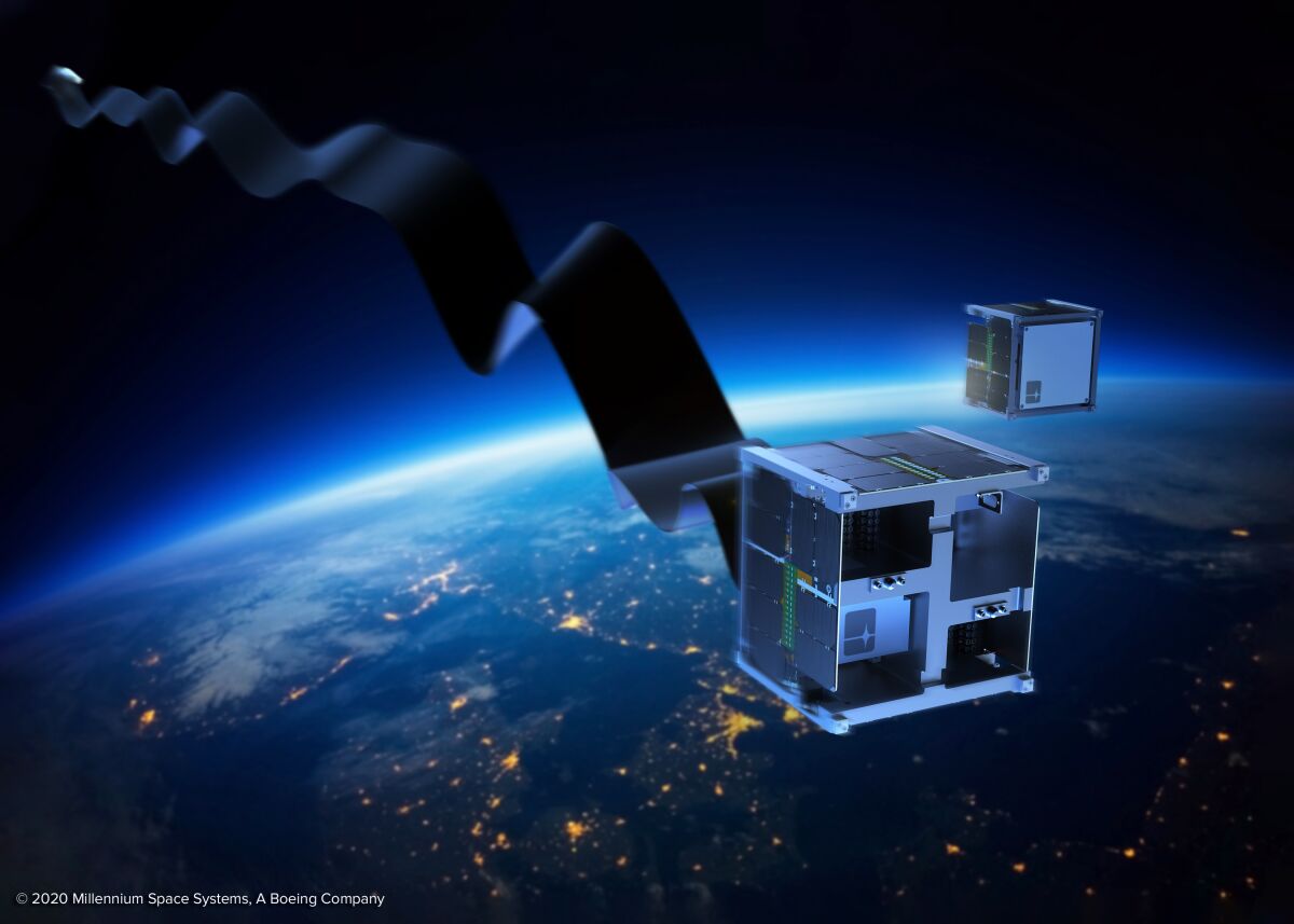 An artist rendition of a long ribbon unfolding from a square satellite
