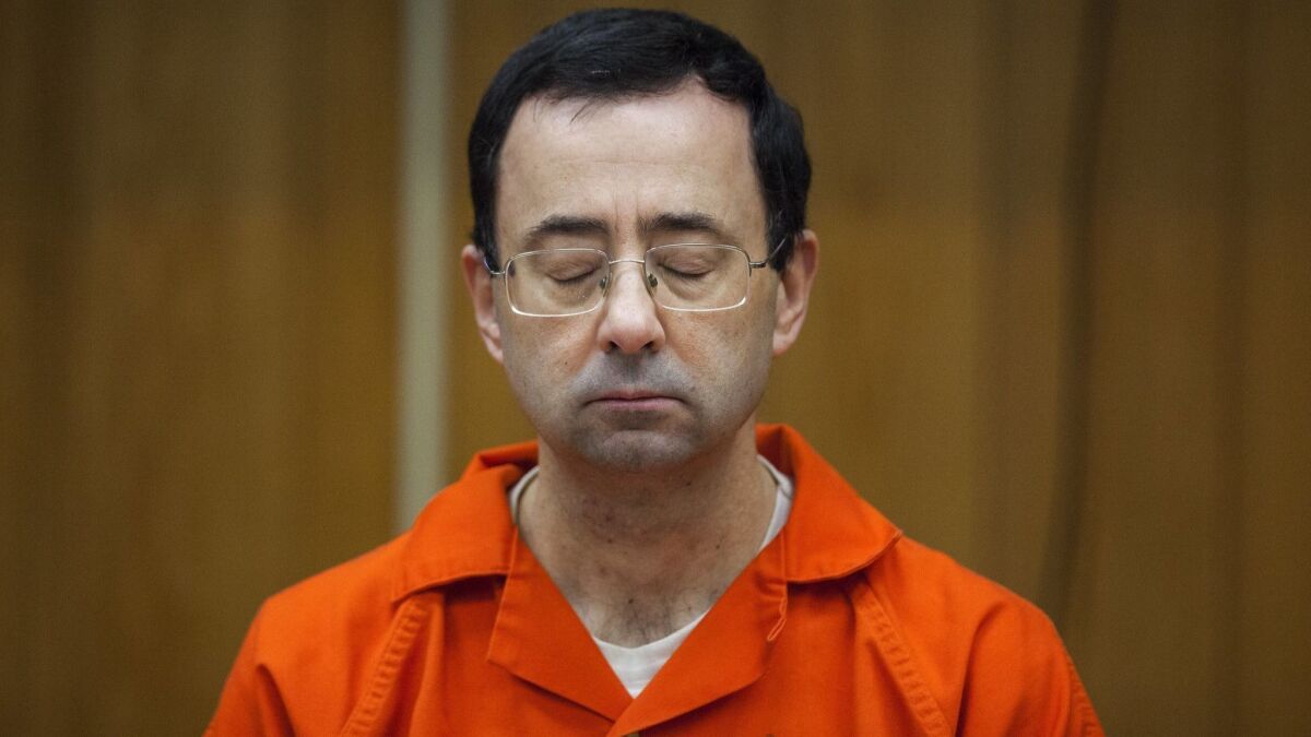 Larry Nassar listens during his sentencing on Feb. 5, 2018, in Charlotte, Mich., on Feb. 5.