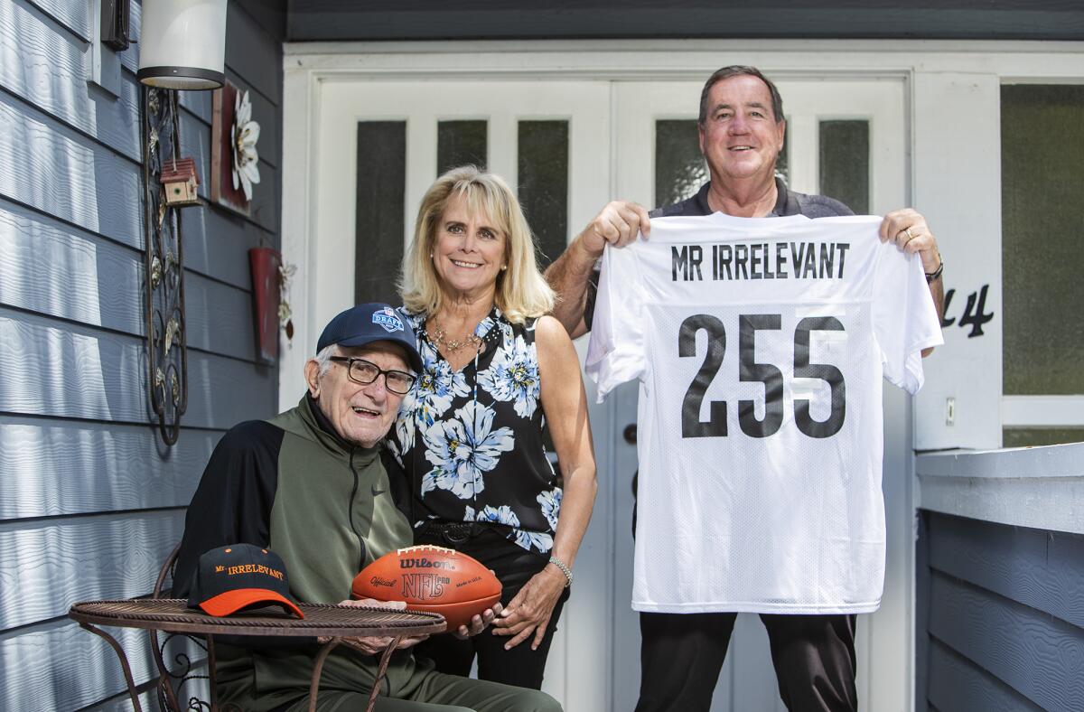 Paul Salata, left, with his daughter, Melanie Salata-Fitch, center, and her husband, Ed Fitch, prepare for the NFL Draft and Mr. Irrelevant.