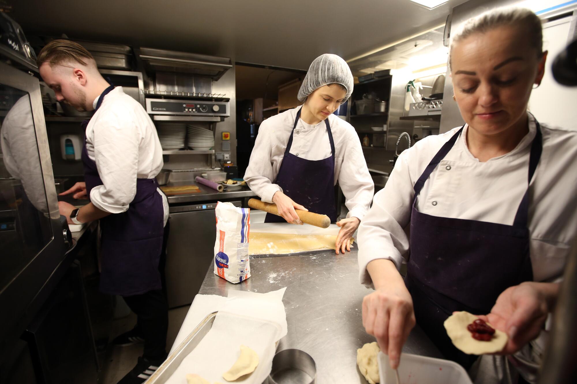 Ukraine refugees working in a Paris restaurant.