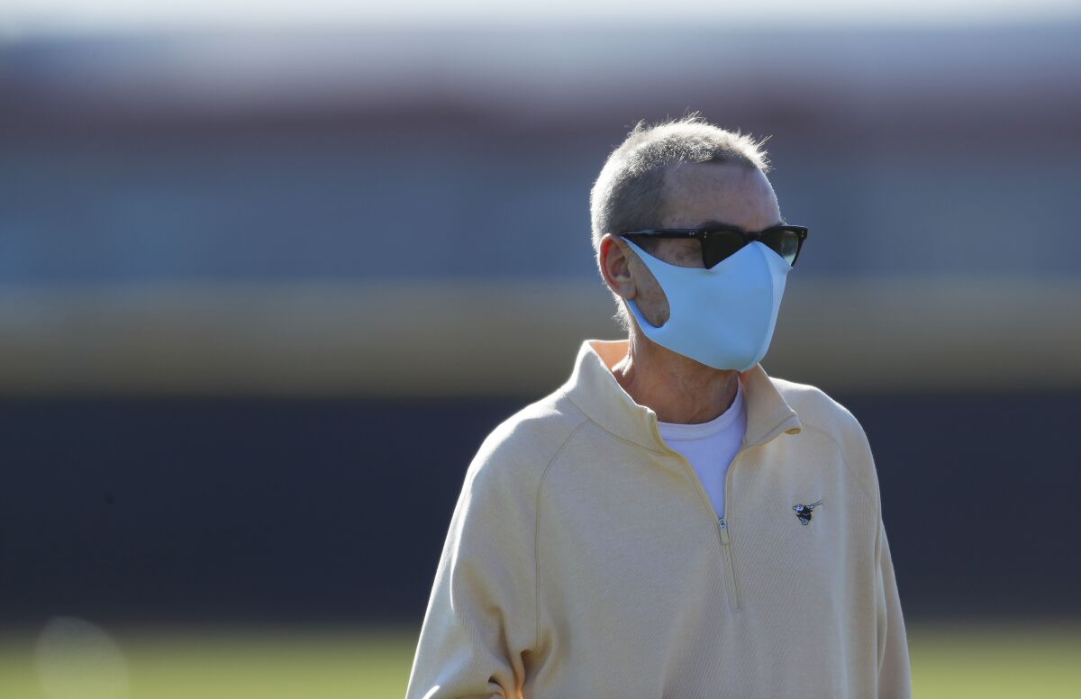 Padres Chairman Peter Seidler looks on during a spring training practice in February in Peoria, Ariz.