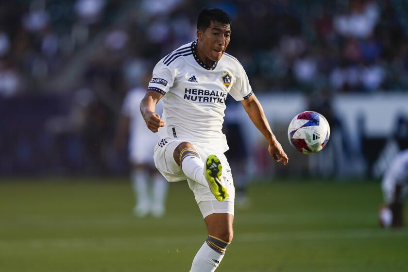 Los Angeles Galaxy midfielder Daniel Aguirre receives the ball during the first half of a Leagues Cup soccer match against the Vancouver Whitecaps, Sunday, July 30, 2023, in Carson, Calif. (AP Photo/Ryan Sun)