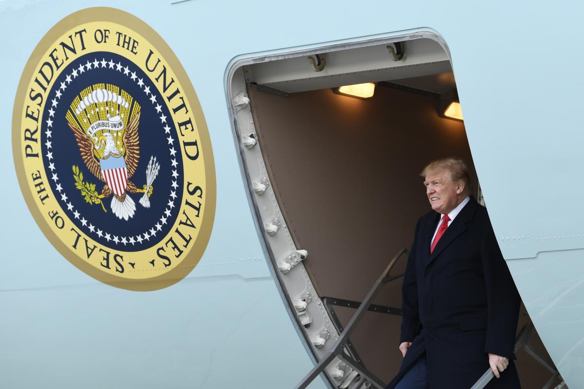 President Trump walks down the steps of Air Force One at Andrews Air Force Base in Maryland in April, 2019.