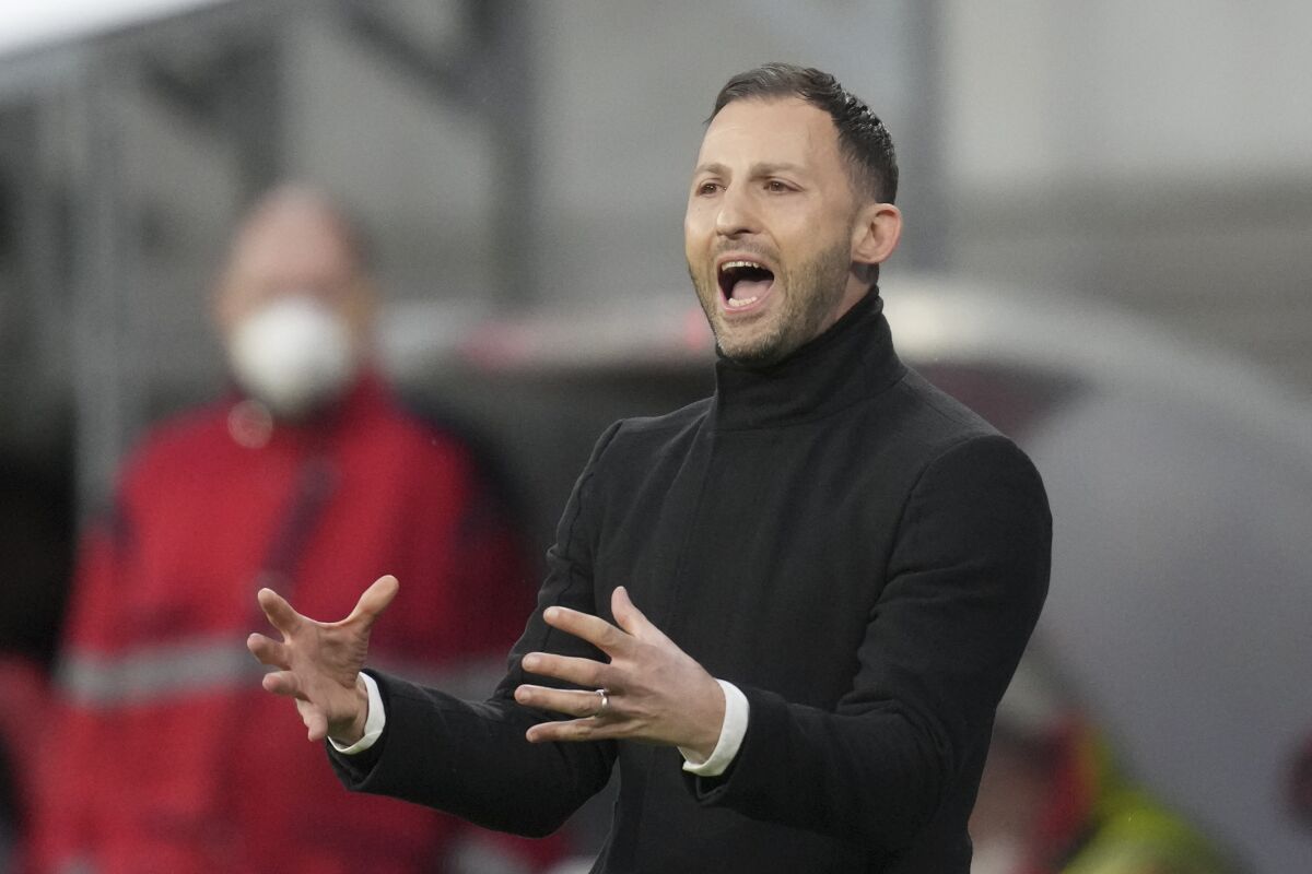 FILE - Leipzig's head coach Domenico Tedesco calls out to his players during an Europa League quarterfinal soccer match between RB Leipzig and Atalanta, in Leipzig, Germany, on April 7, 2022. Tedesco has been appointed as head coach of Belgium's national team to replace Roberto Martinez, the Belgian federation said Wednesday Feb. 8, 2023. (AP Photo/Michael Sohn, File)