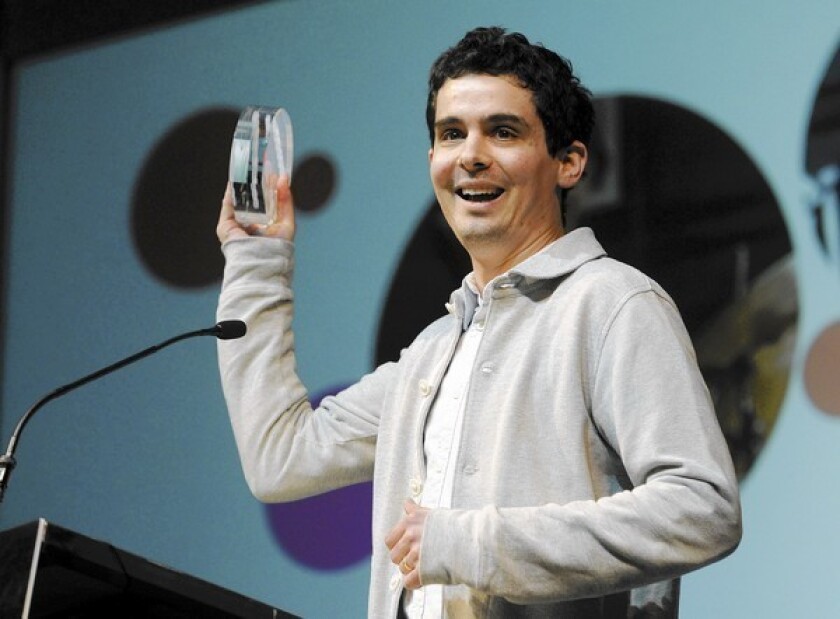Damien Chazelle, director of "Whiplash," accepts the Grand Jury Prize: Dramatic award for his film at the Sundance Film Festival.