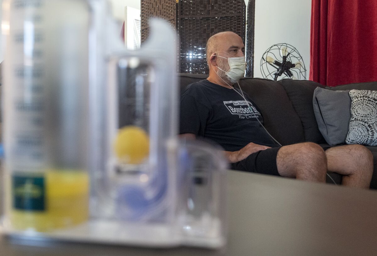 Covid positive patient Adrian Jauregui at home on oxygen following a recent hospitalization. 
