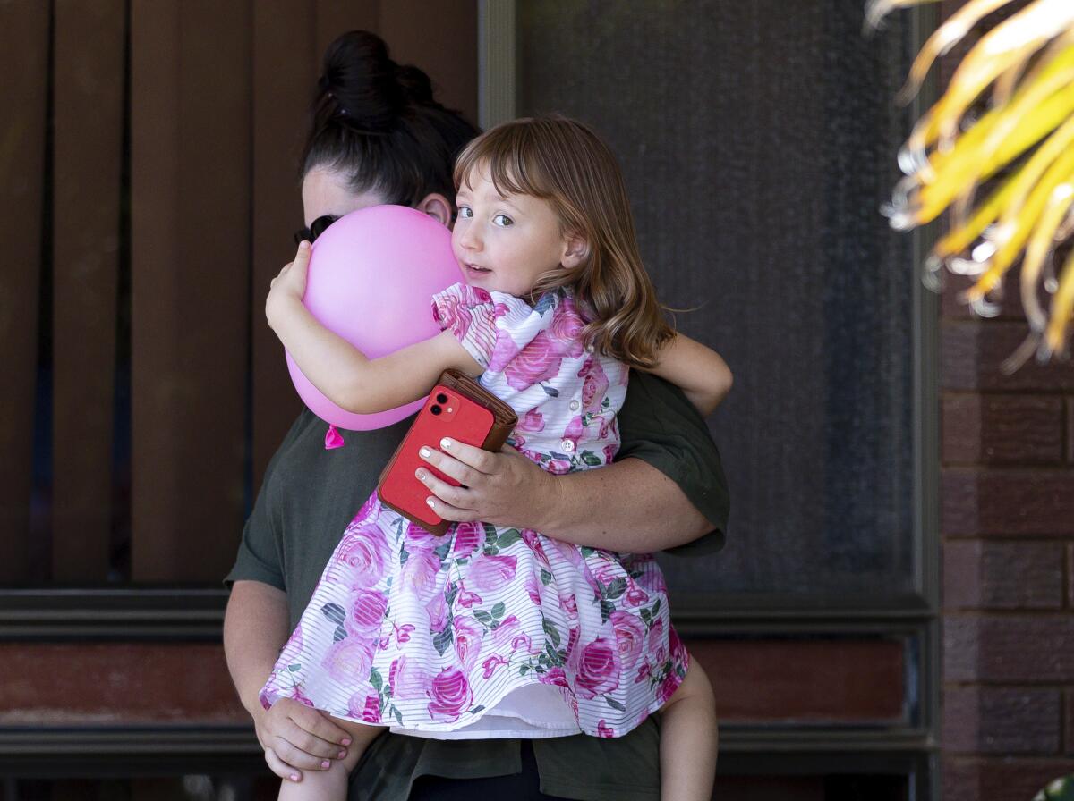 Four-year-old Cleo Smith in her mother's arms