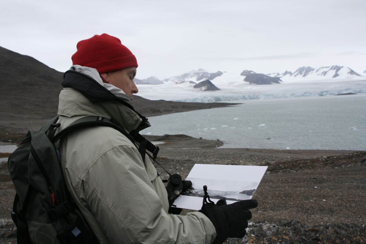 Prince Albert II is seen in 2005 in Svalbard, Norway, comparing the situation there with how it was in 1906, when his great-great-grandfather Prince Albert I visited.
